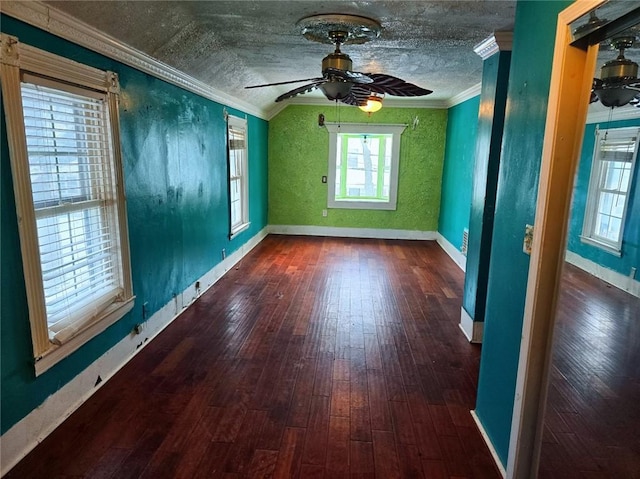 unfurnished room with dark wood-type flooring, crown molding, vaulted ceiling, a textured ceiling, and ceiling fan