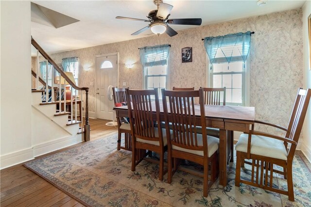 dining room featuring hardwood / wood-style floors, ceiling fan, and a healthy amount of sunlight