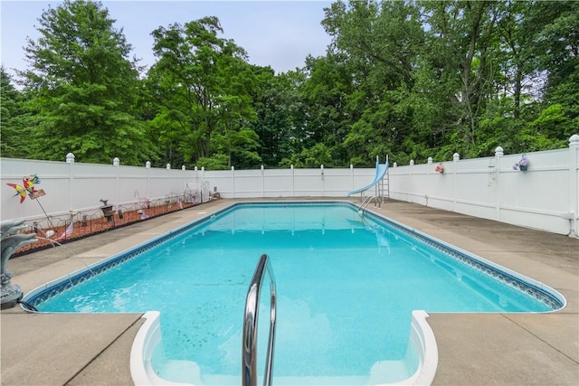 view of pool featuring a water slide