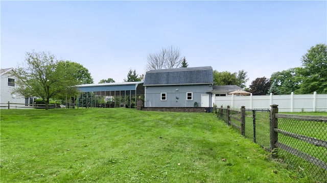 back of house featuring a yard