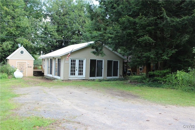 exterior space with a storage shed