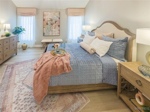 bedroom with light wood-type flooring