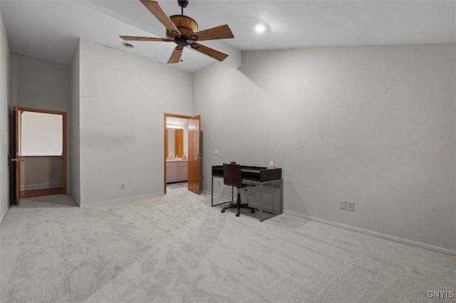 carpeted office featuring ceiling fan and vaulted ceiling