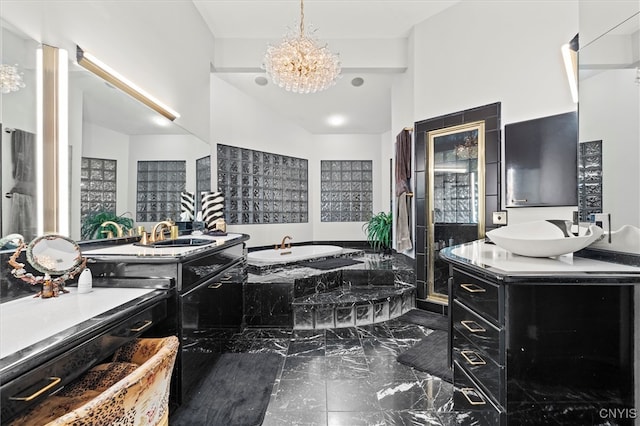 bathroom featuring vanity, a relaxing tiled tub, a high ceiling, and a notable chandelier