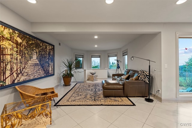 tiled living room with plenty of natural light