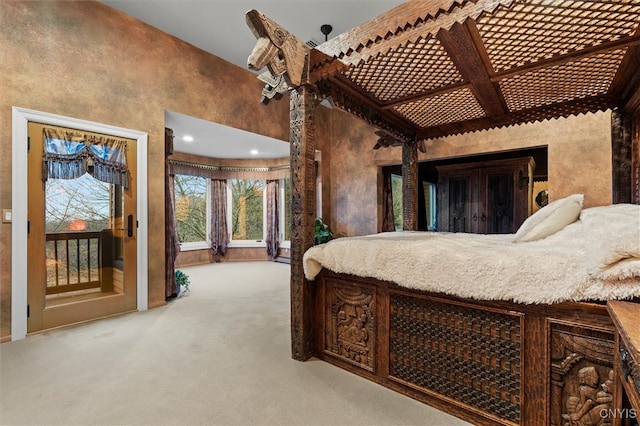 bedroom featuring light colored carpet