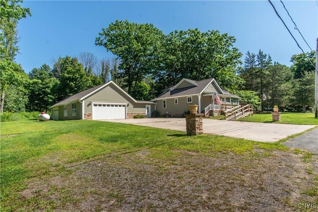 view of front of house with a garage, a porch, and a front yard