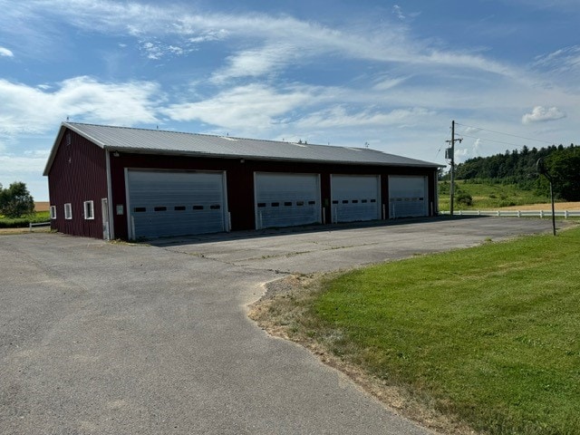 garage with a yard