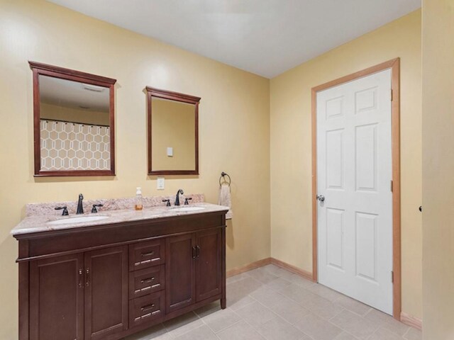 1724 Calhoun Hill Rd, Andes, NY 13731 - full bathroom with double vanity, baseboards, and tile patterned flooring