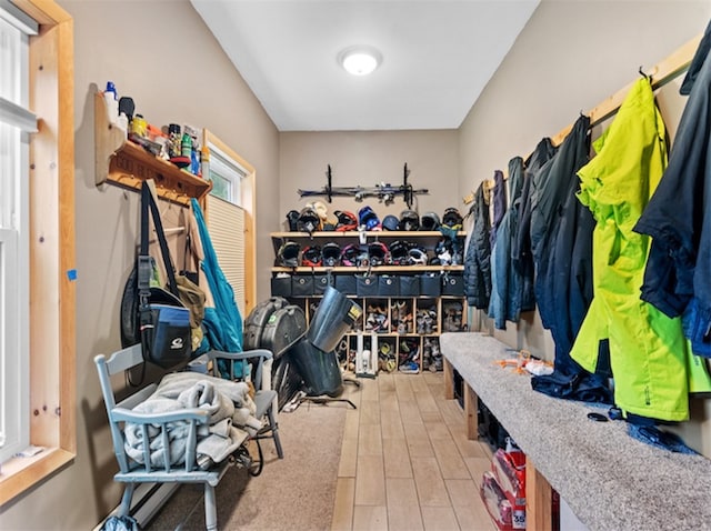 mudroom with light hardwood / wood-style flooring