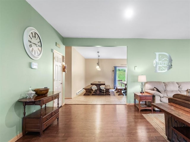 1724 Calhoun Hill Rd, Andes, NY 13731 - living room featuring hardwood / wood-style flooring, a baseboard radiator, and baseboards