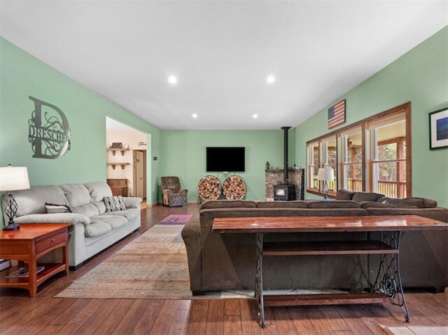 1724 Calhoun Hill Rd, Andes, NY 13731 - living area featuring a wood stove, hardwood / wood-style flooring, and recessed lighting