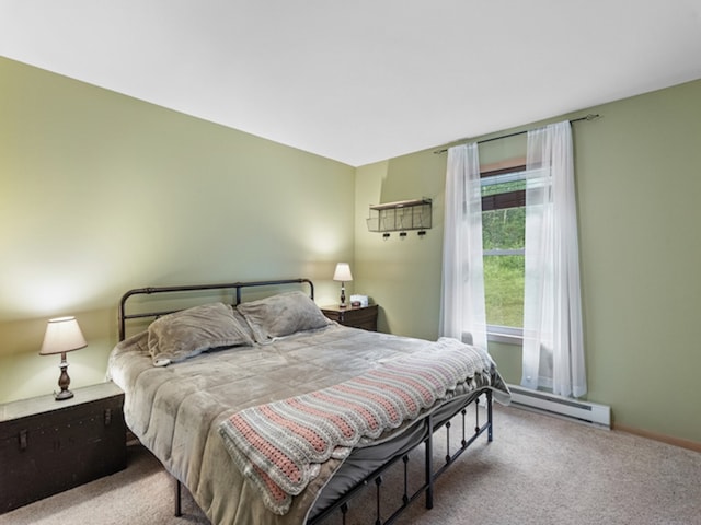 bedroom featuring baseboard heating and carpet floors