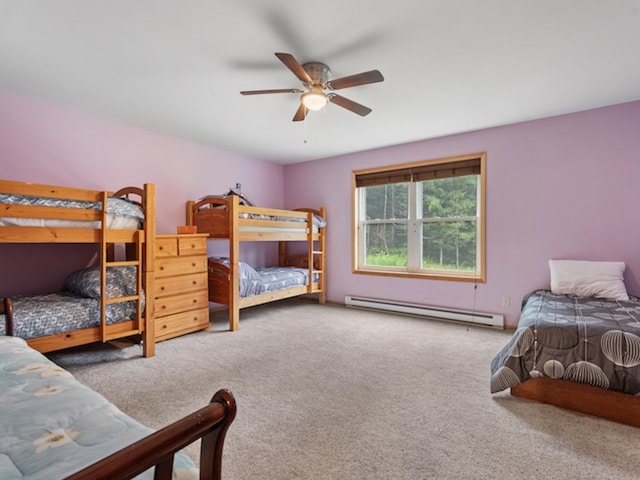 bedroom featuring ceiling fan, a baseboard heating unit, and carpet floors