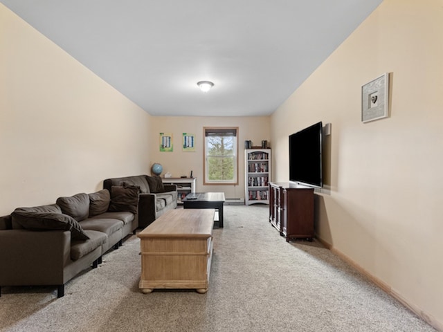 living room with light colored carpet and baseboard heating