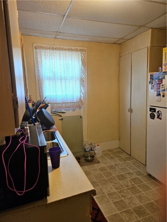 interior space featuring sink and tile patterned flooring