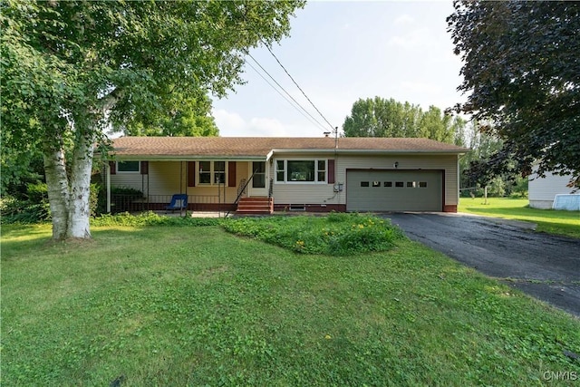 single story home with a garage, a front yard, driveway, and a porch