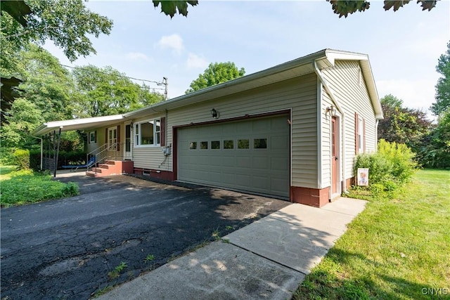 view of front of home featuring driveway and a garage