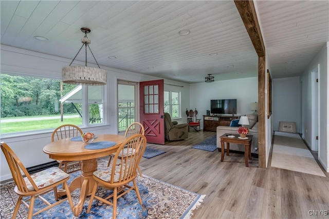 dining area with wooden ceiling and light wood-style flooring