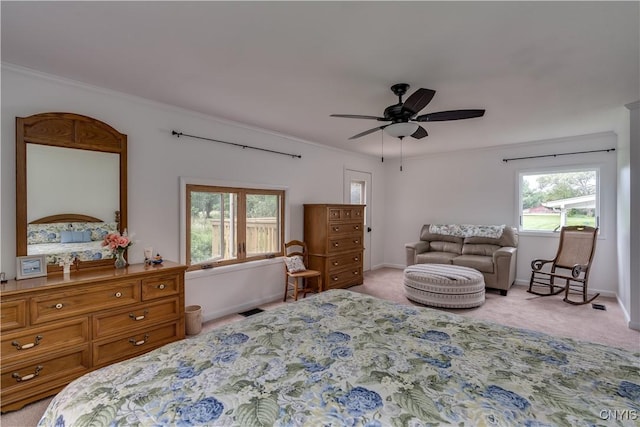 bedroom featuring baseboards, crown molding, and light colored carpet