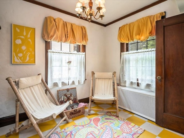 sitting room with crown molding, plenty of natural light, radiator, and a notable chandelier