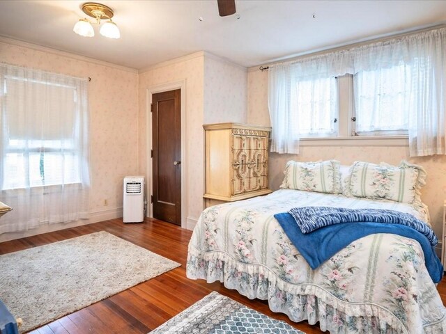 bedroom featuring hardwood / wood-style floors and ceiling fan