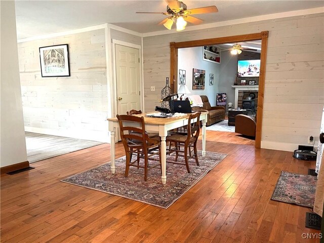 dining space featuring ceiling fan and light wood-type flooring