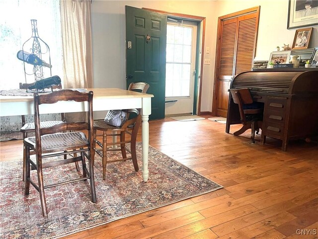 dining area featuring wood-type flooring