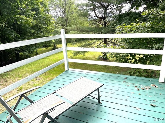 wooden deck with a yard