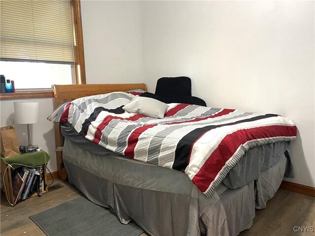 bedroom with light wood-type flooring