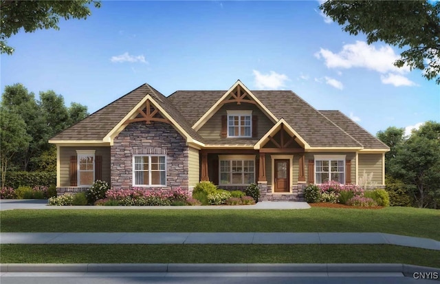 craftsman house featuring a front lawn and stone siding