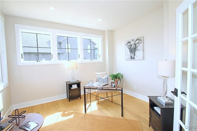 office area featuring recessed lighting, light wood-style floors, and baseboards