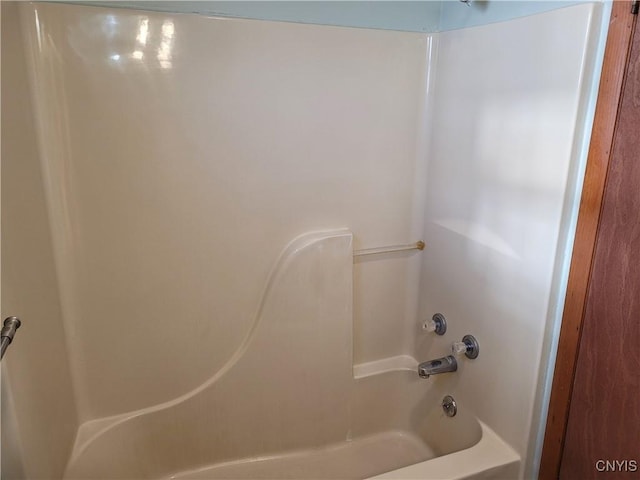 bathroom with shower / tub combination