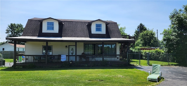 view of front of property with a front yard and a porch