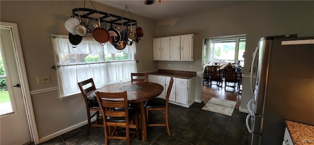 dining room with dark tile patterned floors