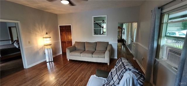 living room featuring ceiling fan, a wealth of natural light, cooling unit, and dark hardwood / wood-style floors