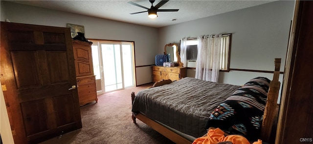 carpeted bedroom featuring a textured ceiling and ceiling fan