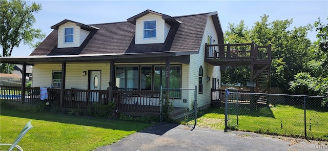 view of front of home featuring a front lawn and covered porch