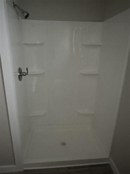 bathroom featuring walk in shower