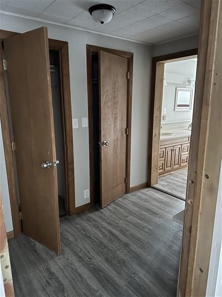 hallway with hardwood / wood-style flooring