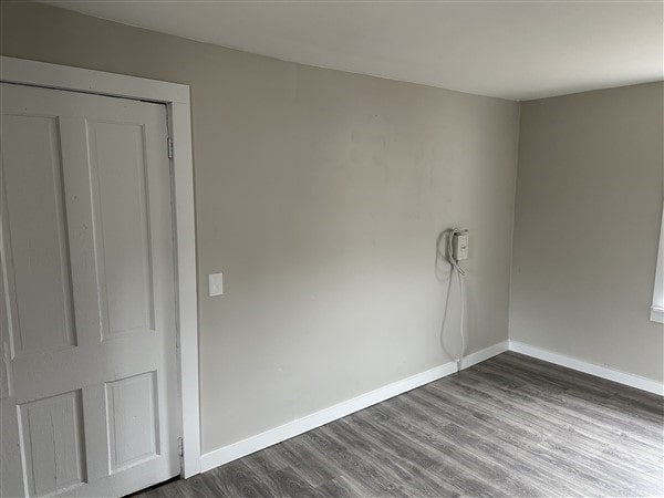 unfurnished room featuring hardwood / wood-style floors