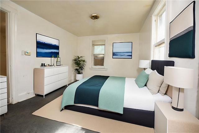 bedroom with dark colored carpet