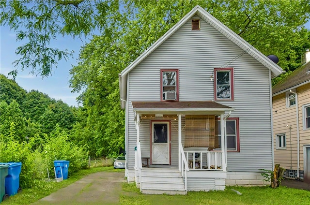 rear view of property with cooling unit