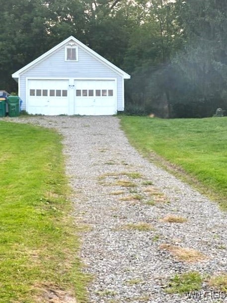 garage with a lawn