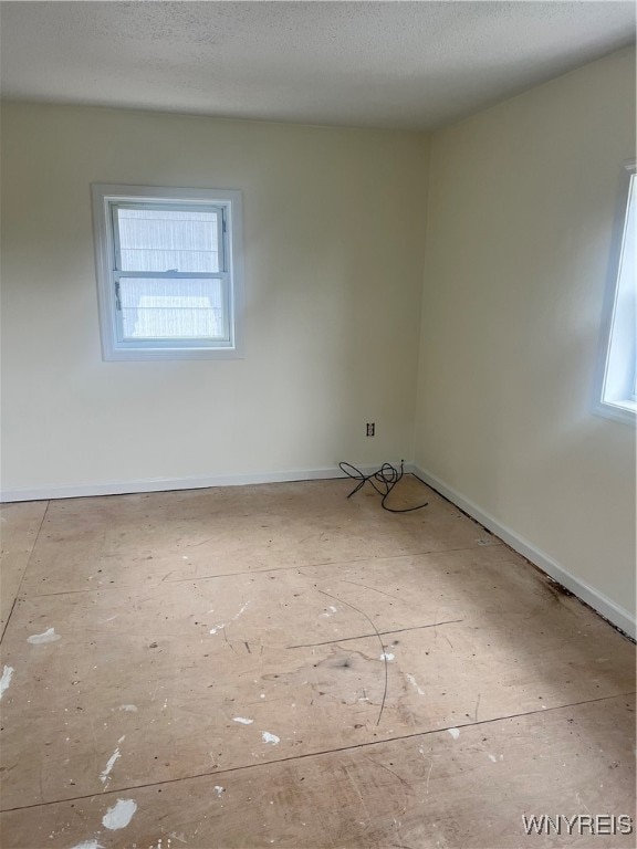 spare room featuring a textured ceiling