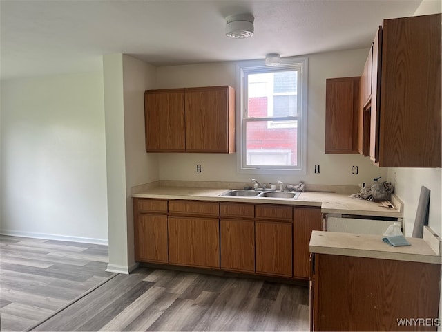 kitchen featuring sink and dark hardwood / wood-style floors