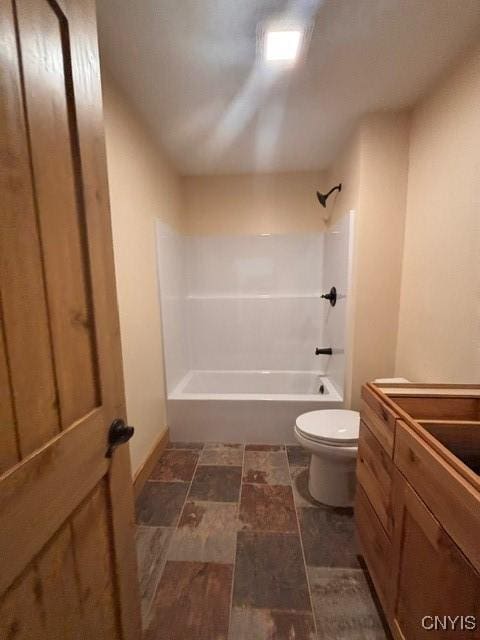 full bath featuring toilet, shower / tub combination, and vanity