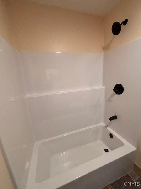 bathroom featuring shower / washtub combination and tile patterned flooring