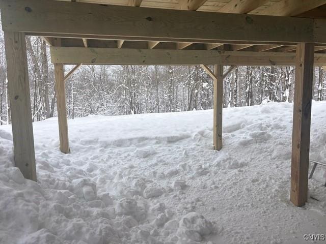 view of yard layered in snow