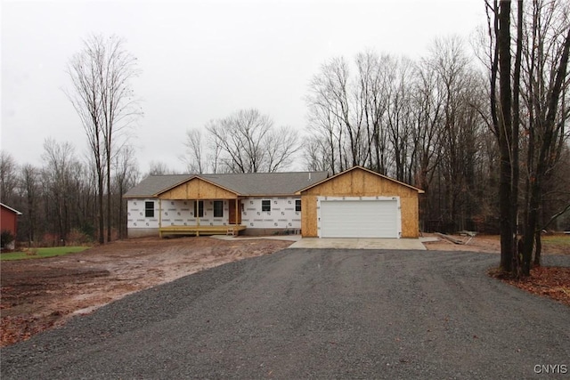 view of front of home with a porch and driveway